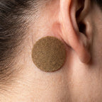Aurenza Shop EarBliss Tinnitus Relief Patch package with multiple patches for ear tinnitus relief, shown in a close-up view.