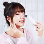 Aurenza Blackhead Remover Pore Vacuum Cleaner shown in use, with sleek black design and clear suction head for facial blackhead extraction.