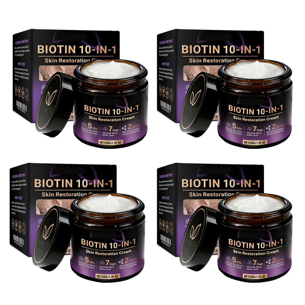 Two jars of Aurenza Shop Biotin 10-in-1 Skin Restoration Cream, made and shipped from the USA, shown with fresh green leaves.
