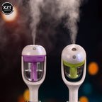 Black Aurenza Shop Mini Car Humidifier showing compact design and nozzle for air humidification in a vehicle interior.