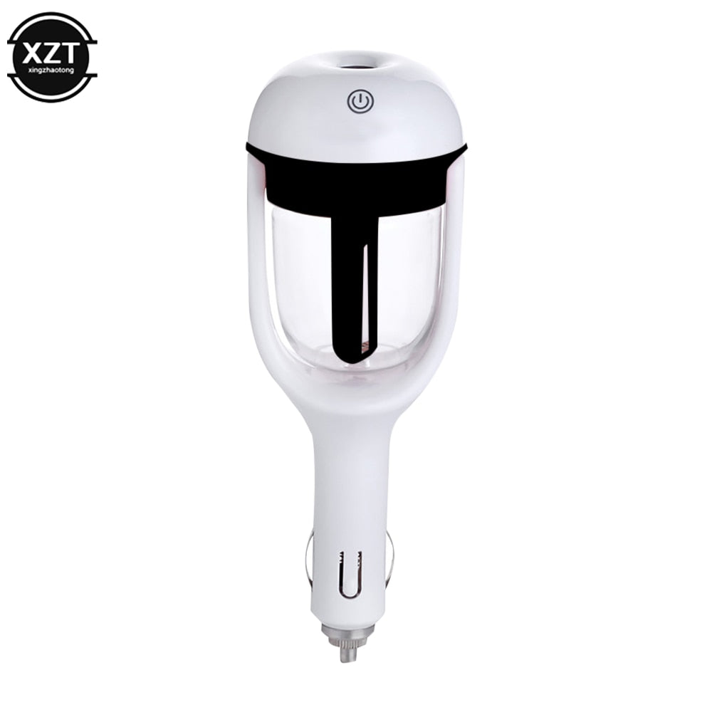 Black mini car humidifier from Aurenza Shop, compact device with water tank and nozzle, designed for vehicle use.