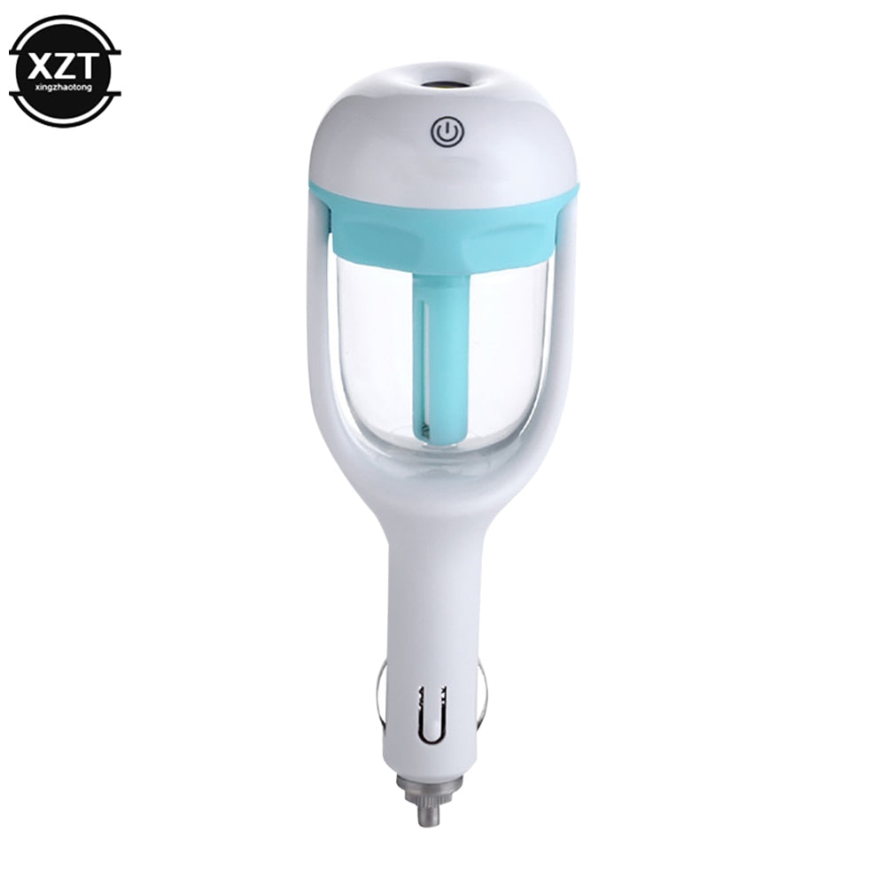 Black Aurenza Shop mini car humidifier emitting a gentle mist inside a vehicle cabin. Compact and portable design for travel use.