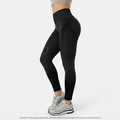 Black high-waisted yoga tights from Aurenza Shop with hip lifting design and quick-drying elastic fabric, shown on a model.