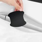 Set of four Aurenza Shop carbon fiber door handle protector films, anti-scratch stickers for car door handle customization.