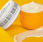 Brazilian Bum Bum Cream by Aurenza Shop, featuring a sleek jar with a golden lid and cream inside, set against a light background.