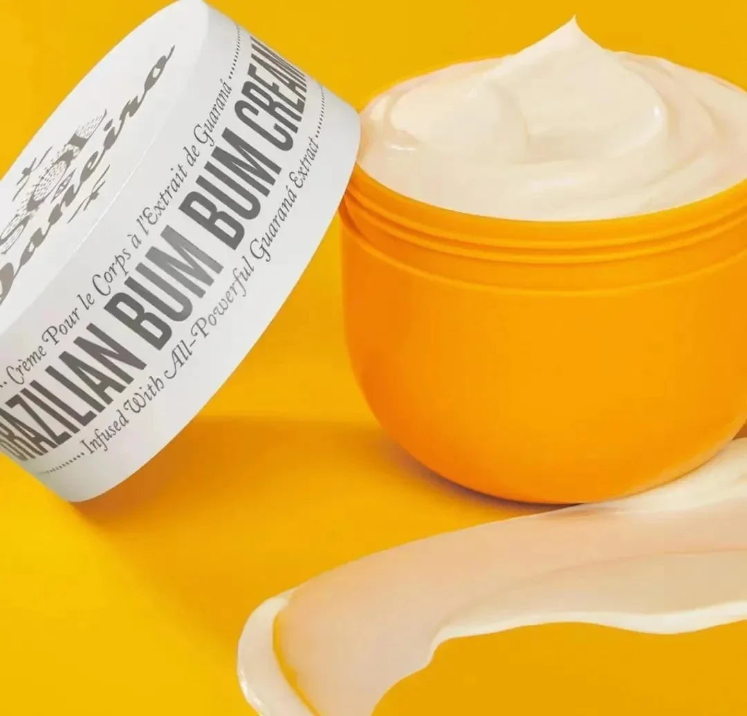 Brazilian Bum Bum Cream by Aurenza Shop, featuring a sleek jar with a golden lid and cream inside, set against a light background.