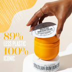 Aurenza Shop Brazilian Bum Bum Cream jar showing creamy moisturizer with tropical scent, side view, on a white background.