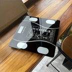 Aurenza Smart Digital Scale with LED display measuring up to 400 lbs, featuring a sleek surface for accurate weight readings.