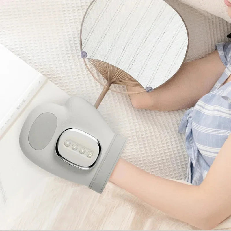 Gray Aurenza Shop cordless hand massager with airbag compression, finger and wrist relief for carpal tunnel pain.