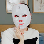 Aurenza Shop Kahuna Red Therapy Facial Mask massager with red mask and ergonomic design for facial skin therapy.