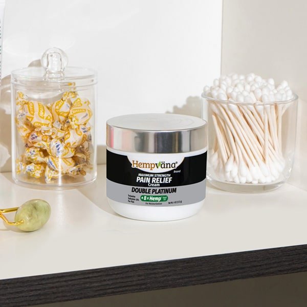 Double Platinum Pain Relief Cream by Aurenza Shop, featuring a tube of pain relief cream with a white and silver design.