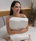 White cervical pillow from Aurenza Shop designed for neck support and relief from discomfort.
